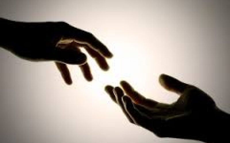 A photo of hands facing each other